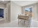 Bright dining area with tile floors, natural light, and seating for six at 10933 Sageview Ave, Las Vegas, NV 89166
