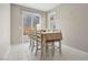 Cozy dining area with tile floors and sliding door to backyard at 10933 Sageview Ave, Las Vegas, NV 89166