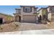 Charming two-story home featuring an attached garage and a beautifully paved driveway at 10933 Sageview Ave, Las Vegas, NV 89166