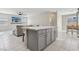Open concept with kitchen island flowing into the living and dining area at 10933 Sageview Ave, Las Vegas, NV 89166