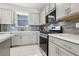 Stylish kitchen with modern appliances and tile backsplash at 10933 Sageview Ave, Las Vegas, NV 89166