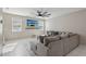 Comfortable living room with large gray sectional sofa and television on the wall at 10933 Sageview Ave, Las Vegas, NV 89166