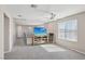 A loft-style room with plush carpeting and a ceiling fan at 10933 Sageview Ave, Las Vegas, NV 89166