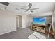 A loft with plush carpeting, a ceiling fan, and a television at 10933 Sageview Ave, Las Vegas, NV 89166