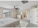Main bedroom featuring a comfortable bed, dresser, ceiling fan, and neutral decor at 10933 Sageview Ave, Las Vegas, NV 89166