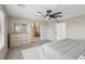 Spacious main bedroom with a ceiling fan, dresser, and ensuite bathroom at 10933 Sageview Ave, Las Vegas, NV 89166