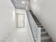 Entry staircase featuring neutral color palette, carpeted steps, and gray railing at 10933 Sageview Ave, Las Vegas, NV 89166
