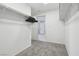 Walk-in closet featuring organized storage with rods and shelves, accessible from an adjoining bathroom at 10933 Sageview Ave, Las Vegas, NV 89166
