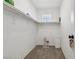A walk-in closet with white walls, carpet, shelves, and hanging rods providing storage space at 10933 Sageview Ave, Las Vegas, NV 89166