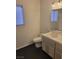 Bathroom with window, toilet, sink and white vanity at 1472 Creslow Ct # 101, Las Vegas, NV 89102