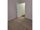This bedroom features neutral carpet, paint, and a door leading to another area of the home at 1472 Creslow Ct # 101, Las Vegas, NV 89102