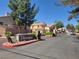Welcoming Kensington neighborhood entrance with lush landscaping and wrought iron gates at 1472 Creslow Ct # 101, Las Vegas, NV 89102