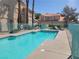 Inviting community pool with blue water and lounge chairs for relaxing summer days at 1472 Creslow Ct # 101, Las Vegas, NV 89102