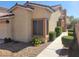 Charming single-story home with manicured bushes and desert landscaping along the walkway at 1472 Creslow Ct # 101, Las Vegas, NV 89102