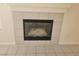 A close up view of a fireplace with tile surrounding at 1472 Creslow Ct # 101, Las Vegas, NV 89102