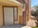 Welcoming front entrance with security door, small window, and attractive landscaping at 1472 Creslow Ct # 101, Las Vegas, NV 89102