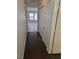 Hallway features wood floors and a view to a well lit room with tiled floors at 1472 Creslow Ct # 101, Las Vegas, NV 89102