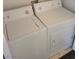 Laundry room features side-by-side washer and dryer at 1472 Creslow Ct # 101, Las Vegas, NV 89102
