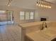 Bright living room featuring tile floors, fireplace, and sliding glass doors to the patio at 1472 Creslow Ct # 101, Las Vegas, NV 89102