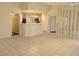 Open concept living room with tile flooring that looks into the kitchen at 1472 Creslow Ct # 101, Las Vegas, NV 89102