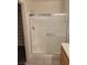 Shower with glass door and a view of shelving and storage in the walk-in closet at 1472 Creslow Ct # 101, Las Vegas, NV 89102