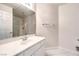 Bathroom area showcasing a vanity with white countertops, sink, and modern fixtures at 1563 Cattle Ranch Pl, Henderson, NV 89002