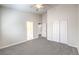 Bedroom featuring carpeted floors, and multiple doors at 1563 Cattle Ranch Pl, Henderson, NV 89002