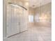 Grand entryway boasts double doors, tile flooring, transom window, and a decorative hanging light fixture at 1563 Cattle Ranch Pl, Henderson, NV 89002