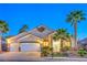 Charming single-story home featuring a three-car garage, desert landscaping, and beautiful curb appeal at 1563 Cattle Ranch Pl, Henderson, NV 89002