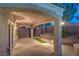Covered patio with view of the landscaped backyard at 1563 Cattle Ranch Pl, Henderson, NV 89002