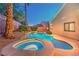 Inviting backyard pool and spa are highlighted by the evening light at 1563 Cattle Ranch Pl, Henderson, NV 89002