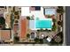 Aerial view of backyard with pool, bocce ball court, patio area, greenery, and outdoor buildings at 197 Ebb Tide Cir, Las Vegas, NV 89123