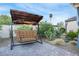 Cozy backyard featuring a swing and landscaped with desert plants at 197 Ebb Tide Cir, Las Vegas, NV 89123