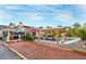 Large backyard with bocce ball court, pool, covered patio, and lounge areas at 197 Ebb Tide Cir, Las Vegas, NV 89123