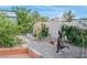 Well-maintained yard with a greenhouse, a garden, and a bronze statue at 197 Ebb Tide Cir, Las Vegas, NV 89123