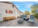Charming backyard patio area perfect for relaxing and entertaining with a lounging area and exterior art at 197 Ebb Tide Cir, Las Vegas, NV 89123