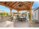 Inviting backyard patio with a built-in barbecue and covered dining area, ideal for outdoor gatherings at 197 Ebb Tide Cir, Las Vegas, NV 89123