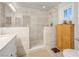 Modern tiled bathroom with a glass-enclosed shower and elegant vanity at 197 Ebb Tide Cir, Las Vegas, NV 89123