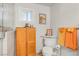 Bathroom includes a toilet, storage cabinet, and bright towels hanging by the glass shower door at 197 Ebb Tide Cir, Las Vegas, NV 89123