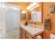 Bathroom with double door access and vanity with a neutral countertop at 197 Ebb Tide Cir, Las Vegas, NV 89123