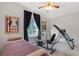 Bedroom showcasing posters, equipment and comfortable bed with natural light from the window at 197 Ebb Tide Cir, Las Vegas, NV 89123