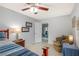 Bedroom features a comfy chair, side table, and views to another room at 197 Ebb Tide Cir, Las Vegas, NV 89123