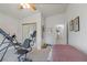 Bedroom showcasing fitness equipment, bed, mirrored closet doors and ample space at 197 Ebb Tide Cir, Las Vegas, NV 89123