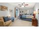 Bedroom with a seating area by the window and a mirrored closet at 197 Ebb Tide Cir, Las Vegas, NV 89123