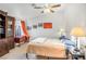 Bright bedroom features a dark wood bookcase and natural light from a window at 197 Ebb Tide Cir, Las Vegas, NV 89123