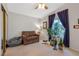 Cozy bedroom with comfortable chair, plants and a relaxing atmosphere by the window at 197 Ebb Tide Cir, Las Vegas, NV 89123