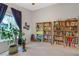 Spacious bedroom featuring built-in bookshelves, carpeted floors and a sunny window at 197 Ebb Tide Cir, Las Vegas, NV 89123