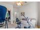Bedroom features fitness equipment, bed, and mirrored closet doors at 197 Ebb Tide Cir, Las Vegas, NV 89123