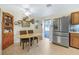 Cozy dining area featuring wood-look floors, vintage decor and doorway to the outside at 197 Ebb Tide Cir, Las Vegas, NV 89123