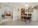 Cozy dining area featuring tile floors and archway to living spaces at 197 Ebb Tide Cir, Las Vegas, NV 89123